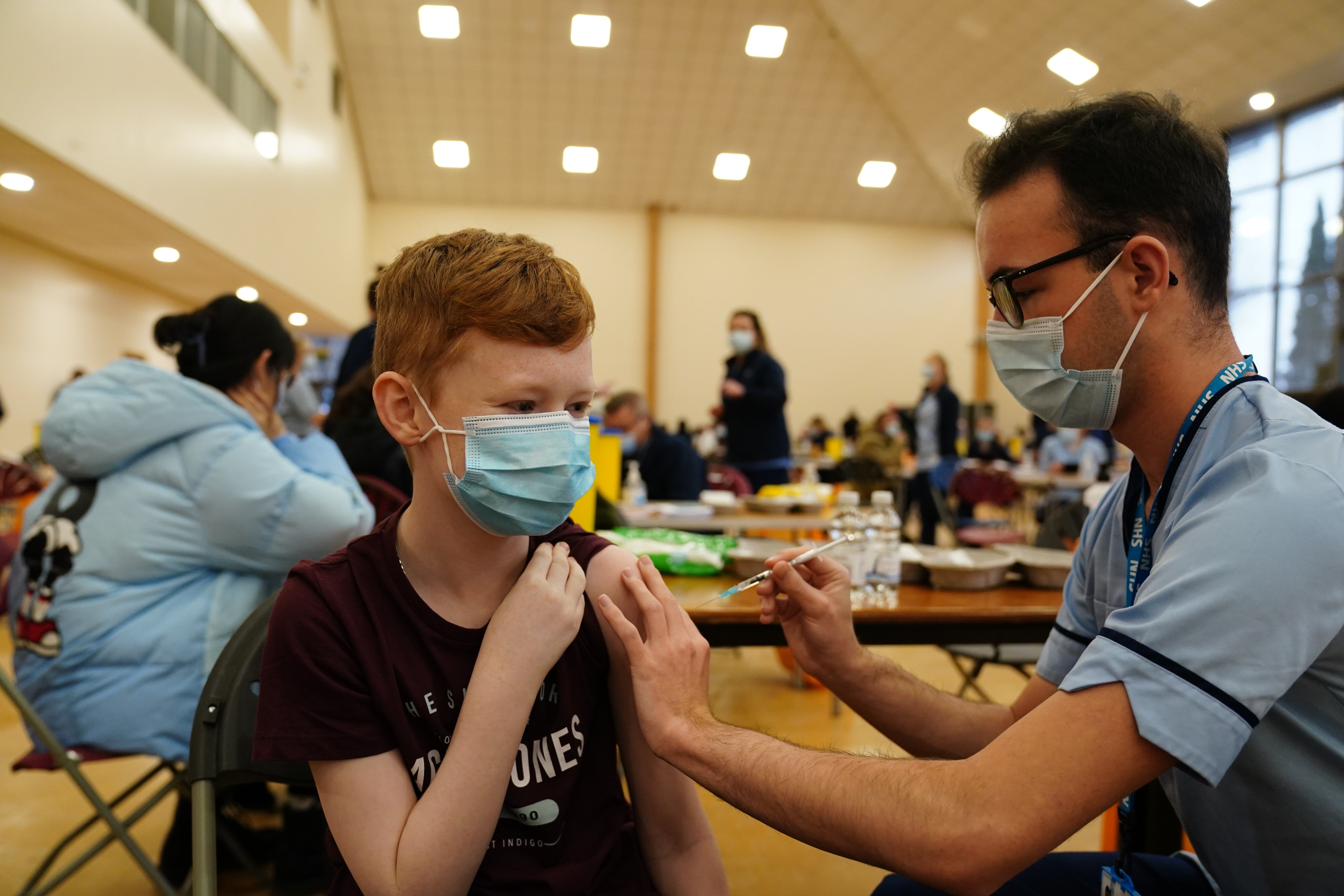 Dean Morrison, 13, receives his Covid-19 vaccine (Jane Barlow/PA)