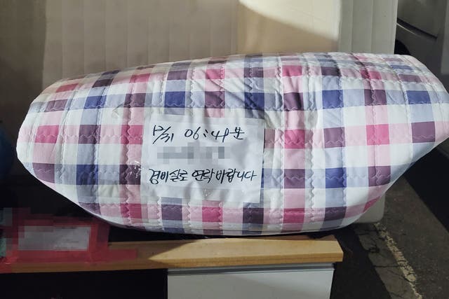 <p>A piece of folded bedding of the North Korean defector</p>