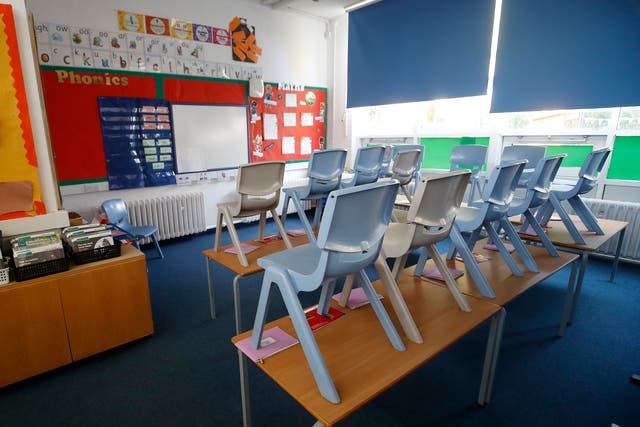 Children are returning to school in Northern Ireland this week amid a rise in the number of Covid cases (Martin Rickett/PA)