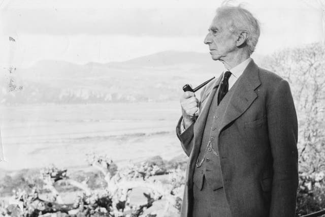 <p>Russell smoking his pipe as he looks out to sea, circa 1960</p>