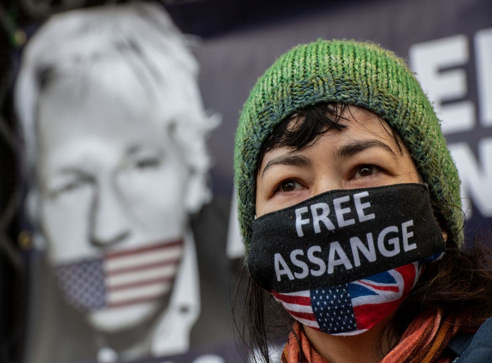 <p>Supporters of Julian Assange react as the judgement is announced outside the Royal Courts of Justice</p>