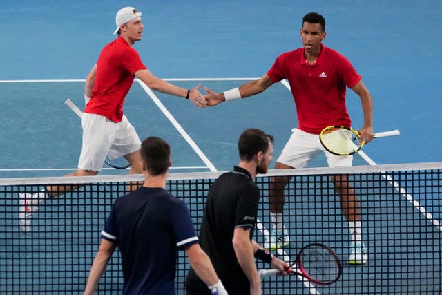 Canada’s Denis Shapovalov and teammate Felix Auger-Aliassime, right, celebrate after winning the first set against Britain’s Jamie Murray and Joe Salisbury in their match at the ATP Cup (Mark Baker/AP)
