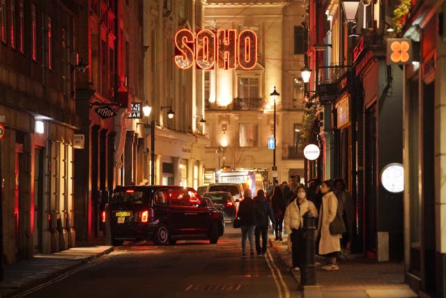 <p>People in Soho, in central London, on 30 December 2021 </p>