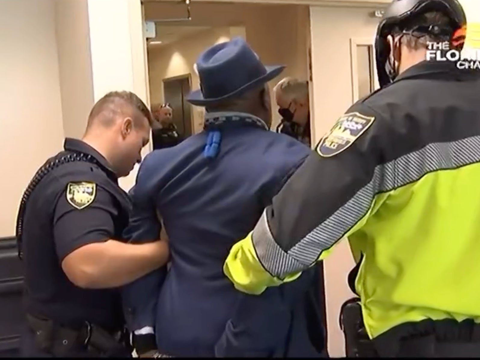 Florida activists, including disabled man, arrested for ‘trespass’ for trying to confront Ron DeSantis on Covid