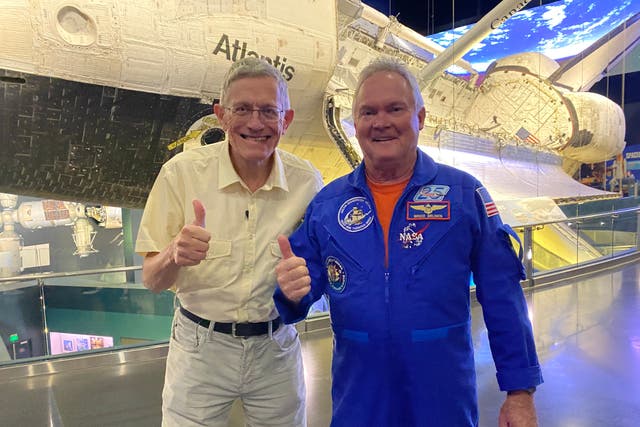 <p>Space invaders: Simon Calder (Left) and Bruce Melnick (Right) beside Space Shuttle Atlantis</p>