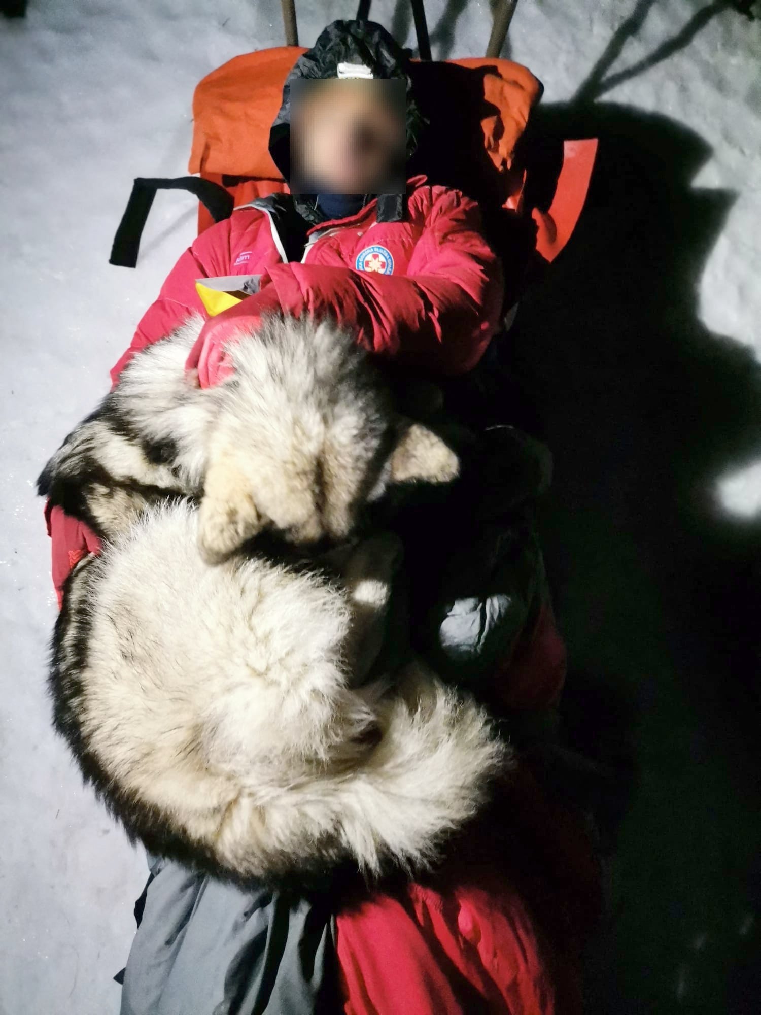 North lying on the hiker as they are rescued on the mountain of Velebit
