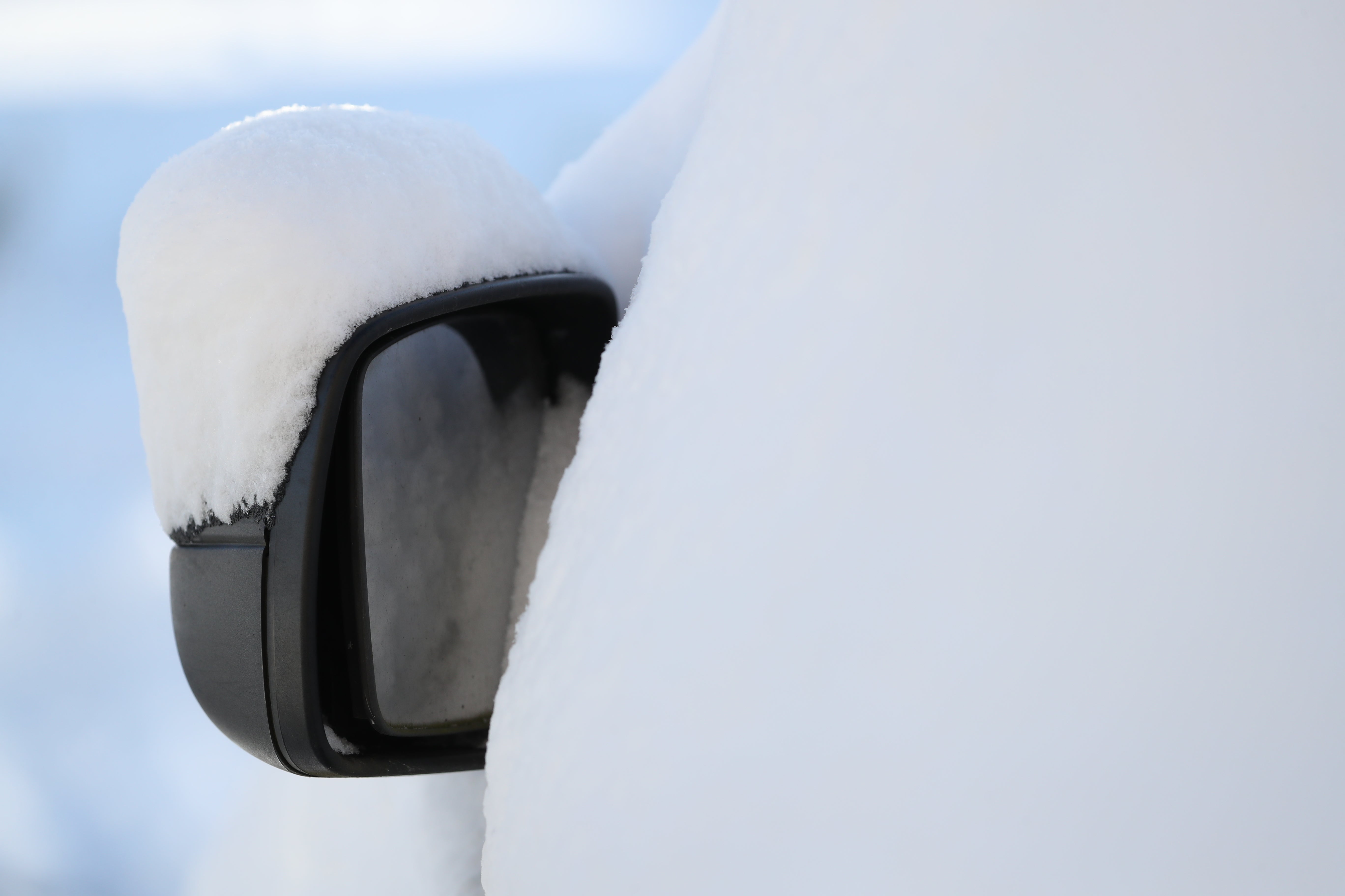 Snow covers a wing mirror (Andrew Milligan/PA)
