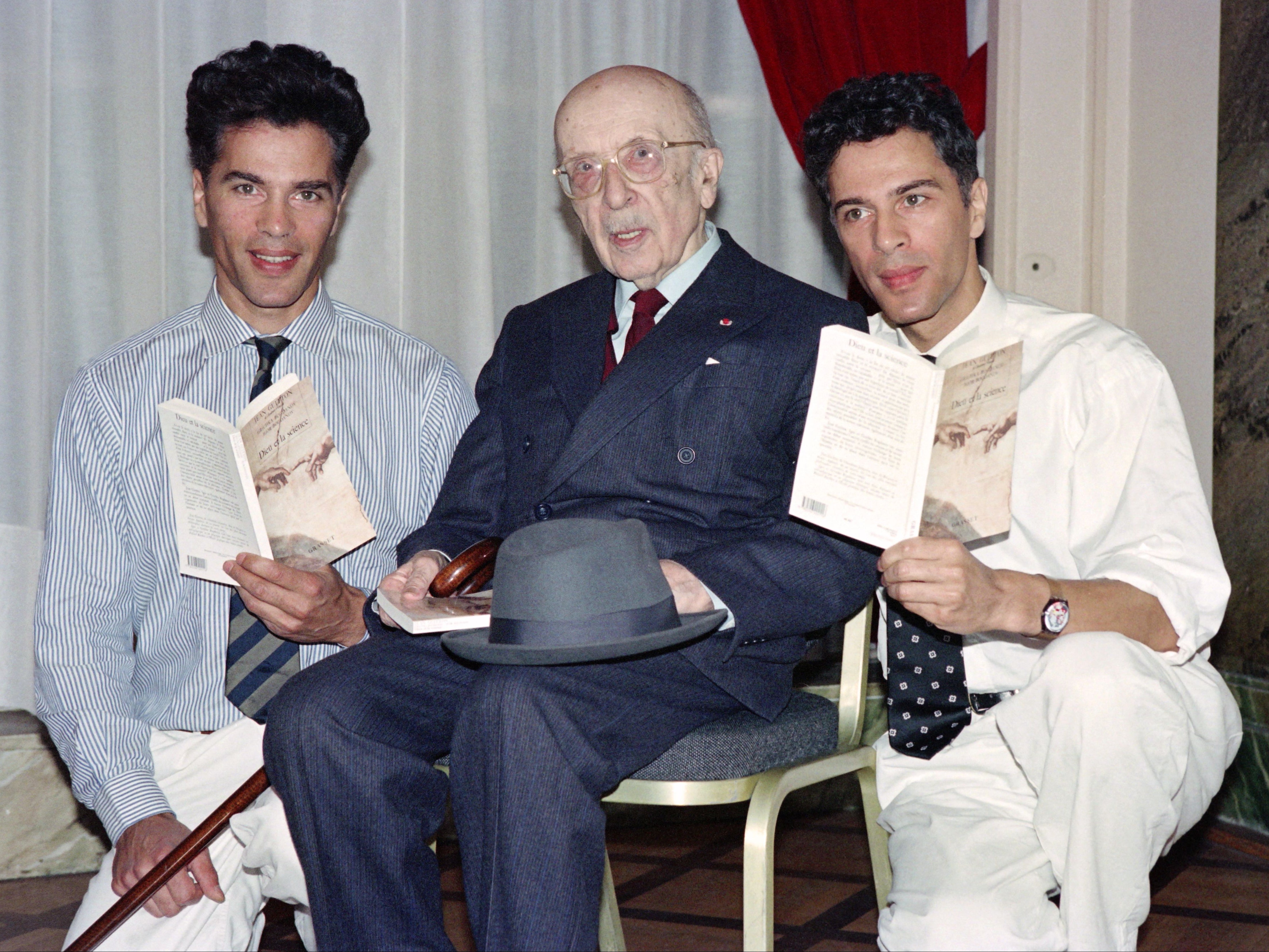 Igor and Grichka Bogdanoff with French writer and philosopher Jean Guitton on 6 September 1991 in Paris, France