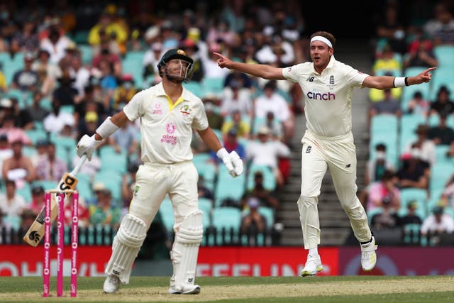 England’s Stuart Broad celebrates the wicket of Australia’s David Warner (Jason O’Brien/PA)