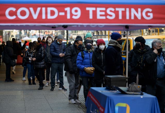 <p>People wait in line to receive a Covid-19 test on 4 January 2022, in New York</p>