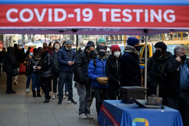 <p>People wait in line to receive a Covid-19 test on 4 January 2022, in New York</p>