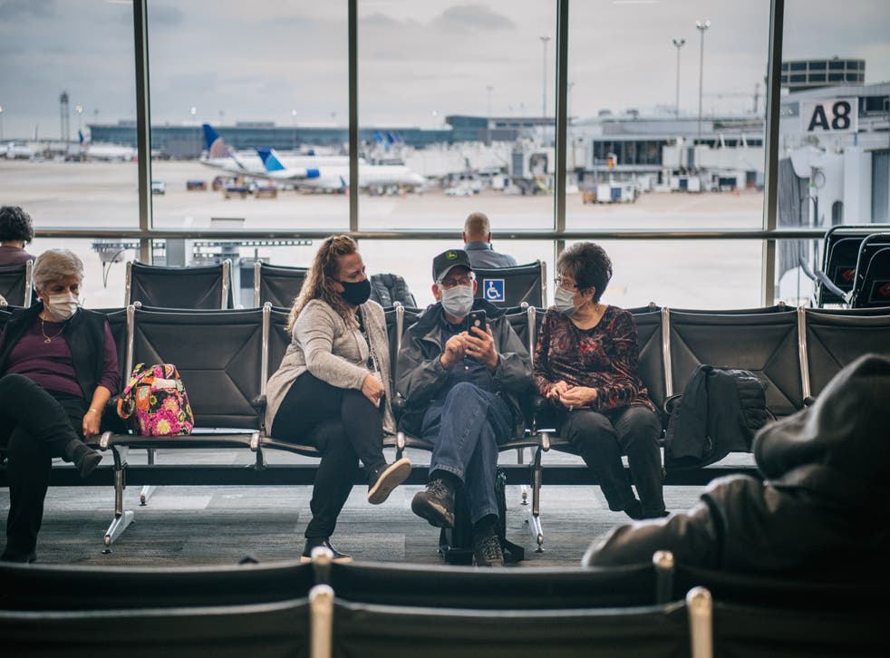 <p>People wait for their plane departure at George Bush Intercontinental Airport on 3 December 2021 in Houston, Texas</p>