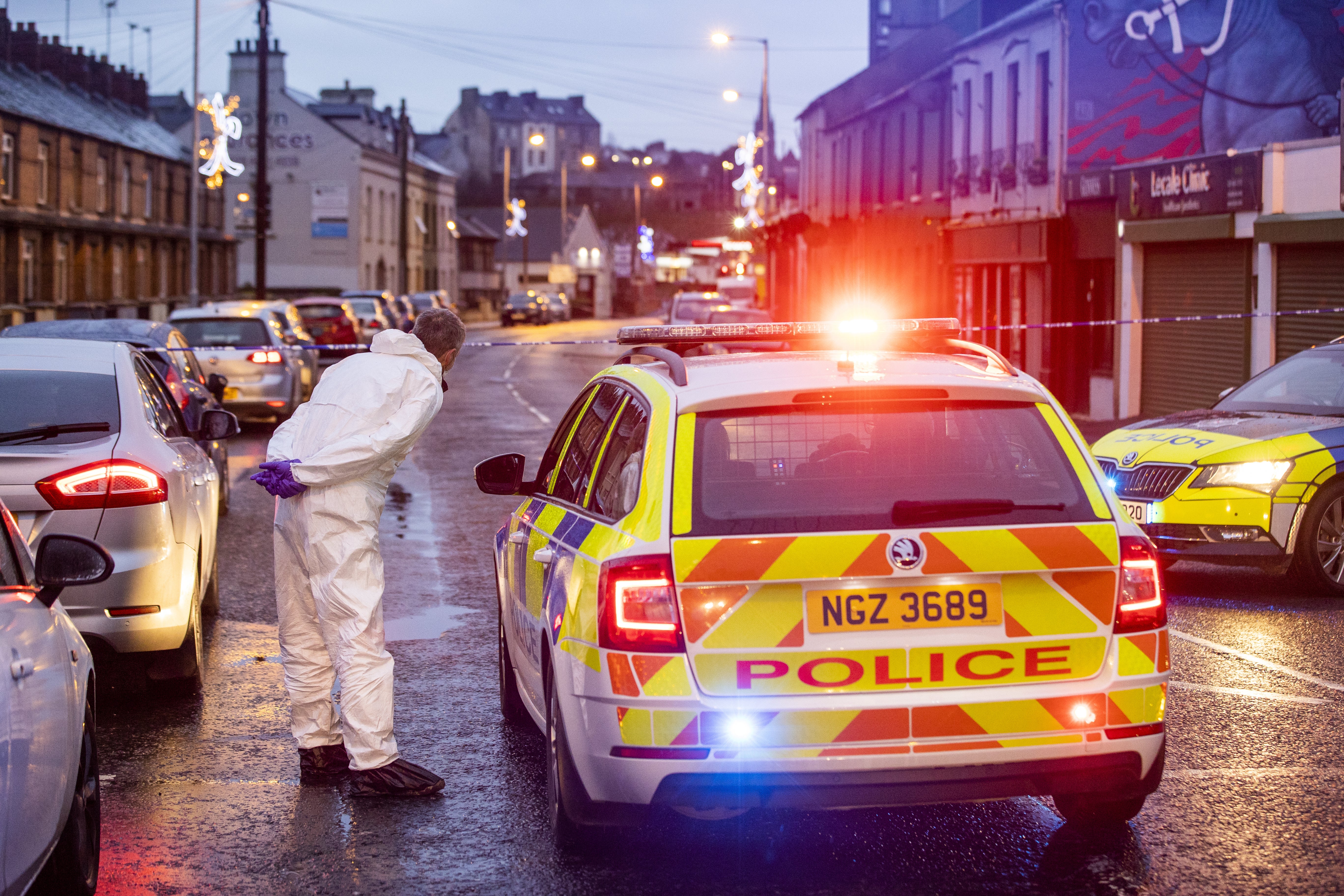 Forensic officers at the scene in Downpatrick, County Down (Liam McBurney/PA)