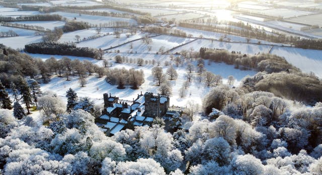 Snow covers Beaufront Castle near Hexham in Northumberland after weather forecasters warned that parts of the UK will face freezing conditions (Owen Humphreys/PA)