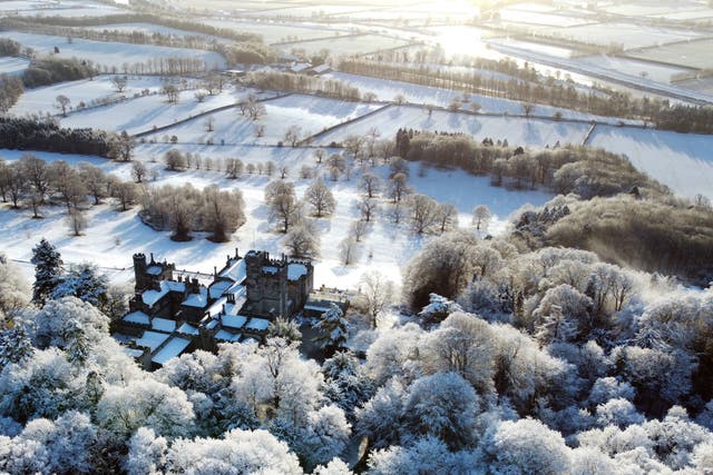 Snow covers Beaufront Castle near Hexham in Northumberland after weather forecasters warned that parts of the UK will face freezing conditions (Owen Humphreys/PA)