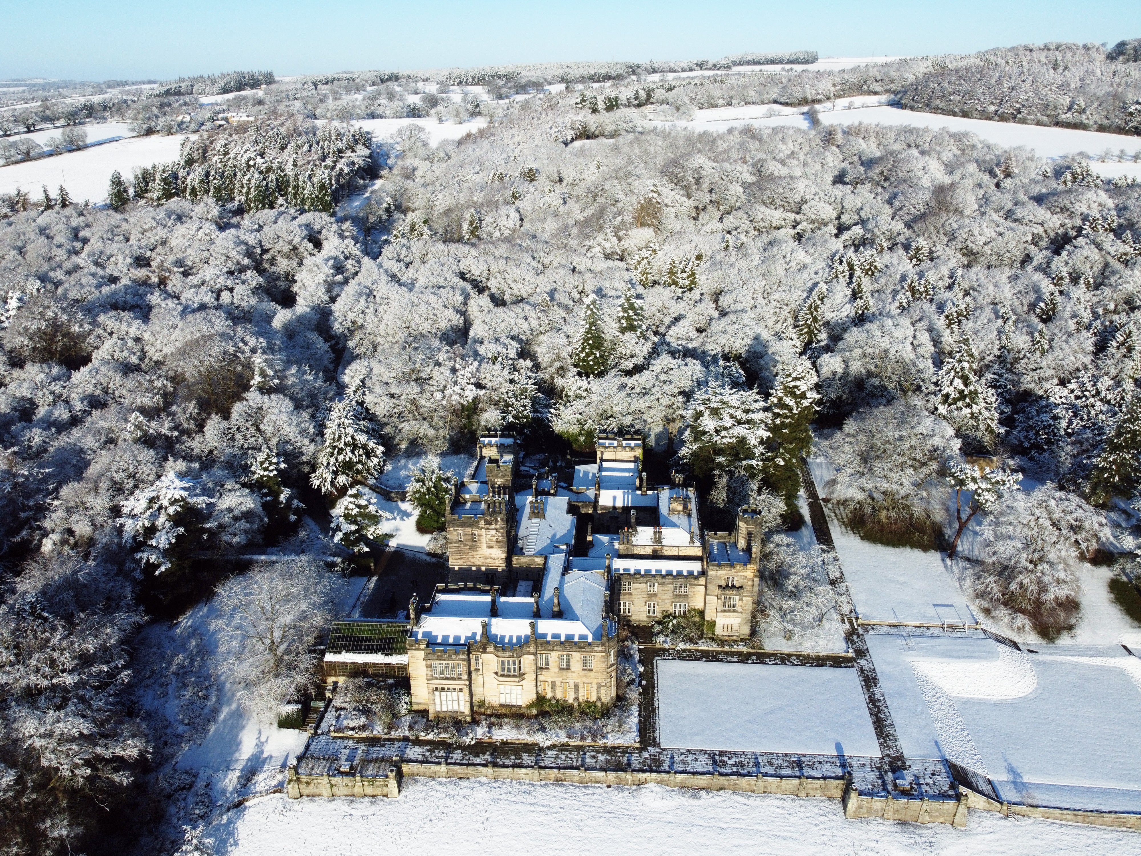 Snow covers Beaufront Castle near Hexham in Northumberland (Owen Humphreys/PA)