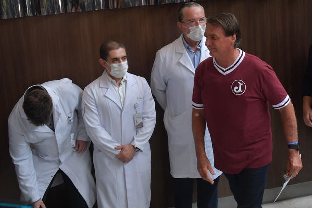 <p>Brazil's President Jair Bolsonaro seen next to his team of doctors during a press conference at the Vila Nova Star Hospital after he was discharged, in Sao Paulo, Brazil</p>
