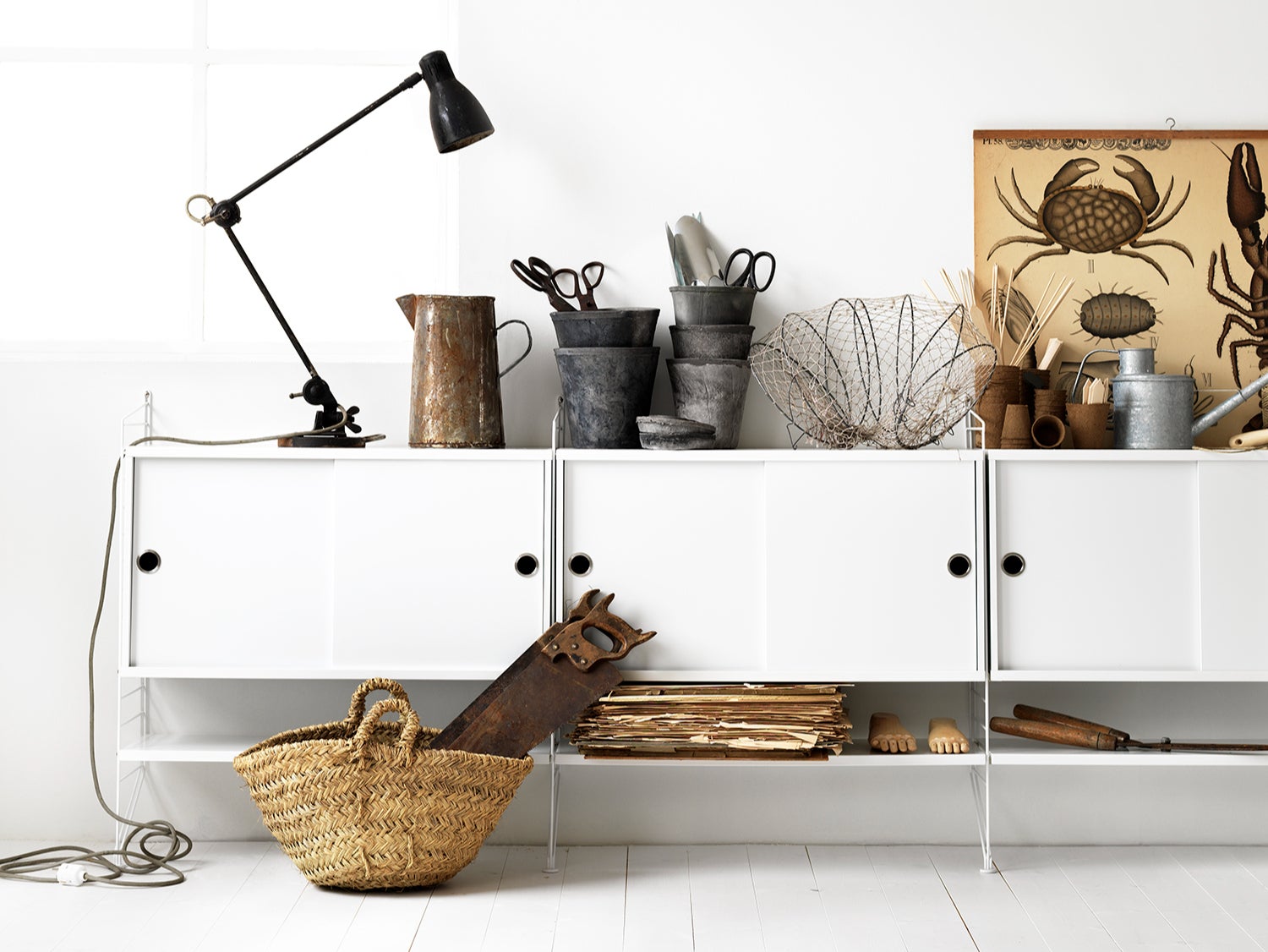 String shelving makes a subtle design statement without distracting from the flow of the room