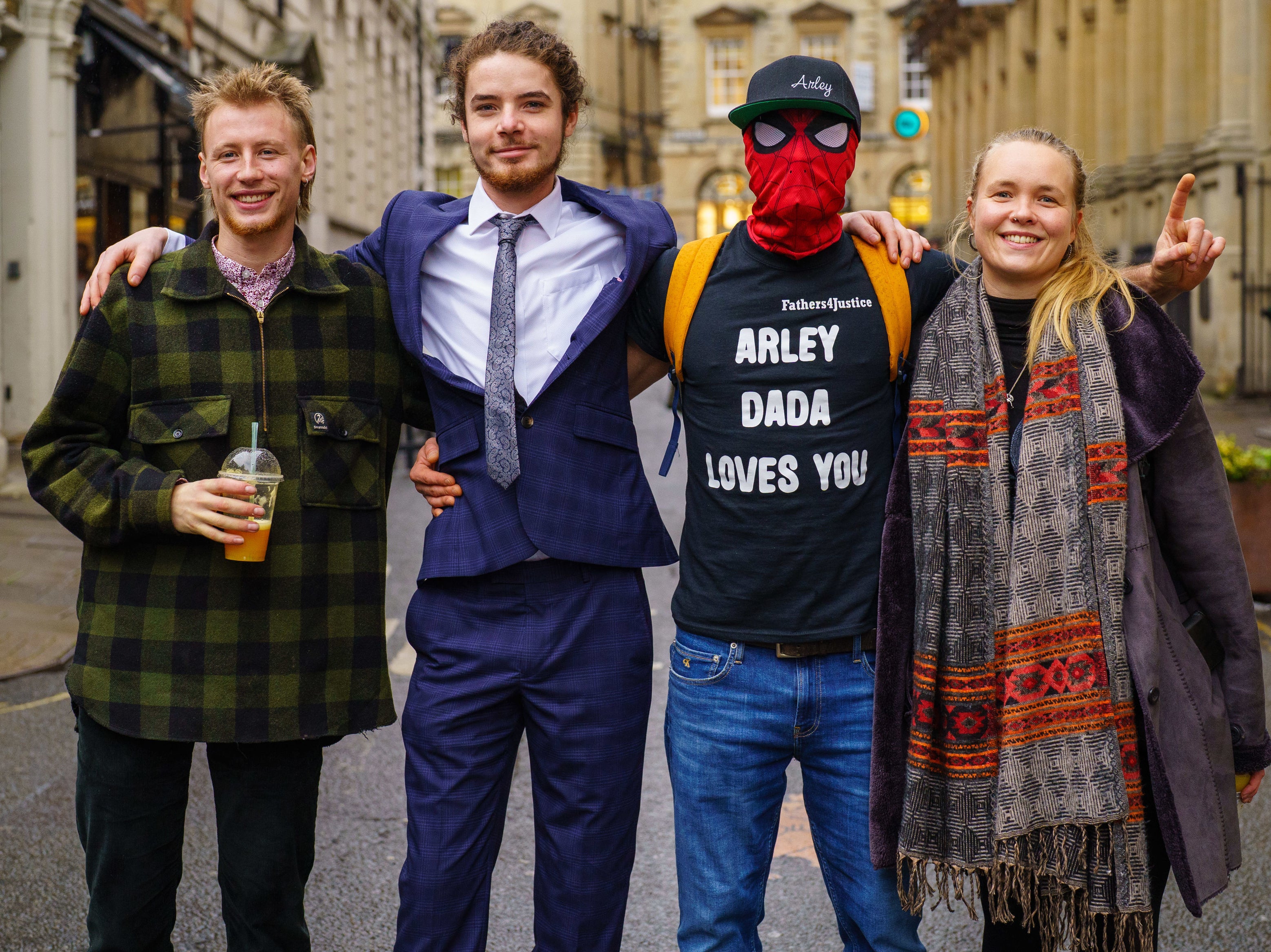 Milo Ponsfor (left), Sage Willoughby (second left), Jake Skuse (second right) in mask, and Rhian Graham (right) have been cleared of criminal damage over the toppling of the statue of slave trader Edward Colston in Bristol