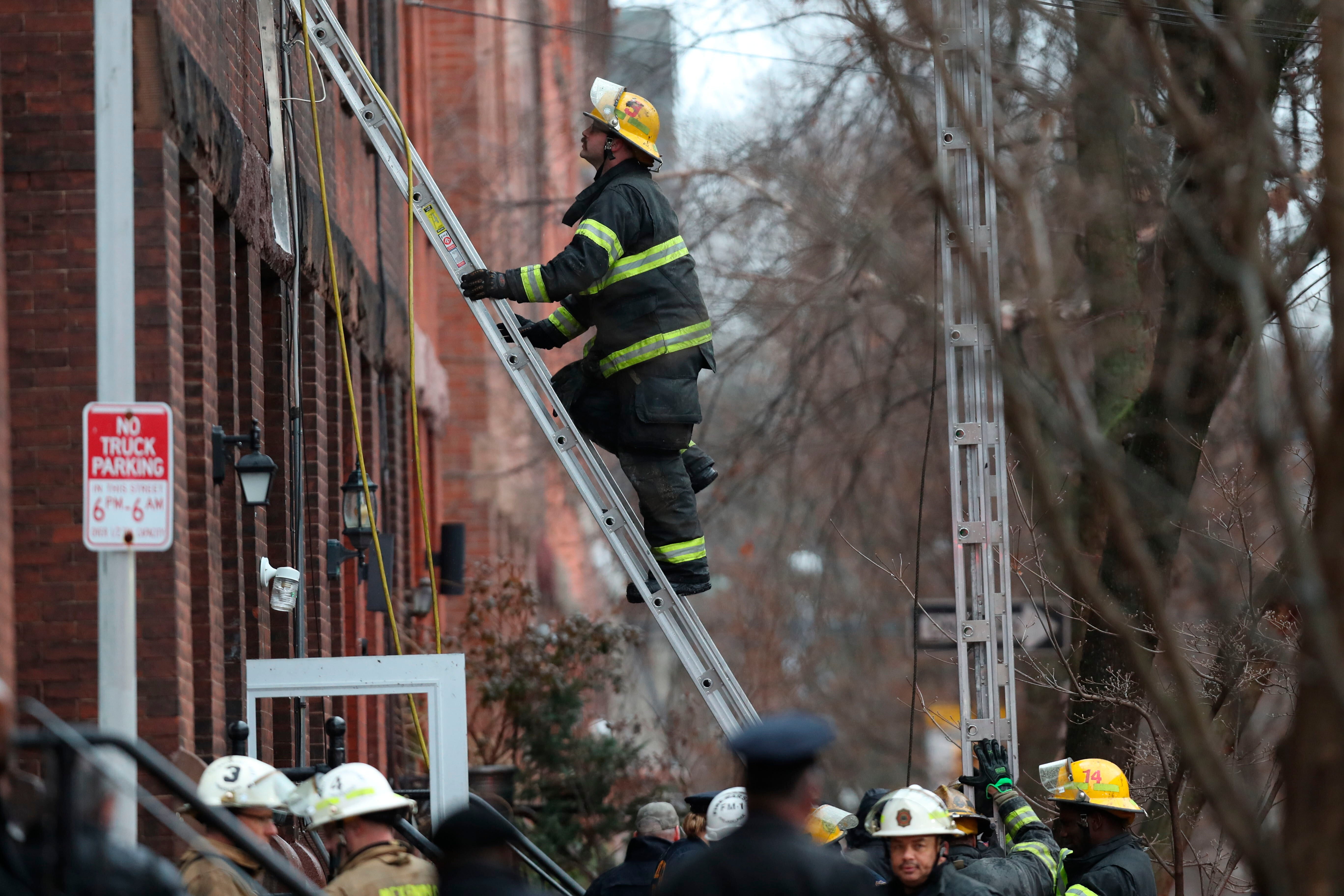 Firefighters work at the scene