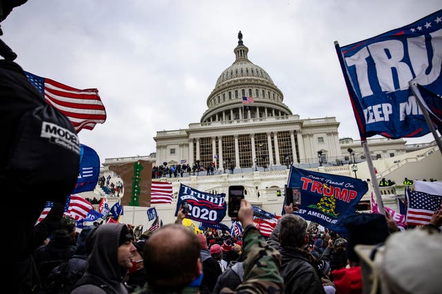 <p>File: Trump supporters storm Capitol Hill on 6 January 2021 after a rally by the then president </p>