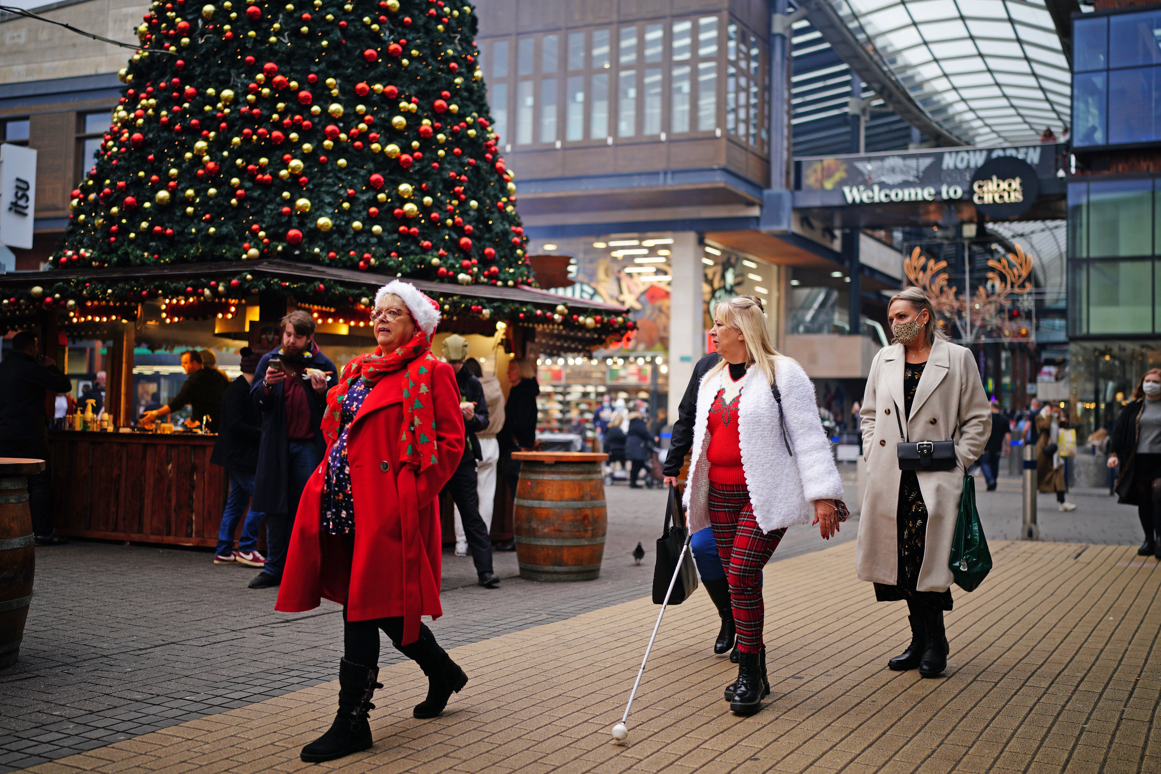 The fear of Omicron put a dampener on footfall figures on Britain’s high streets, figures have shown (Ben Birchall/PA)