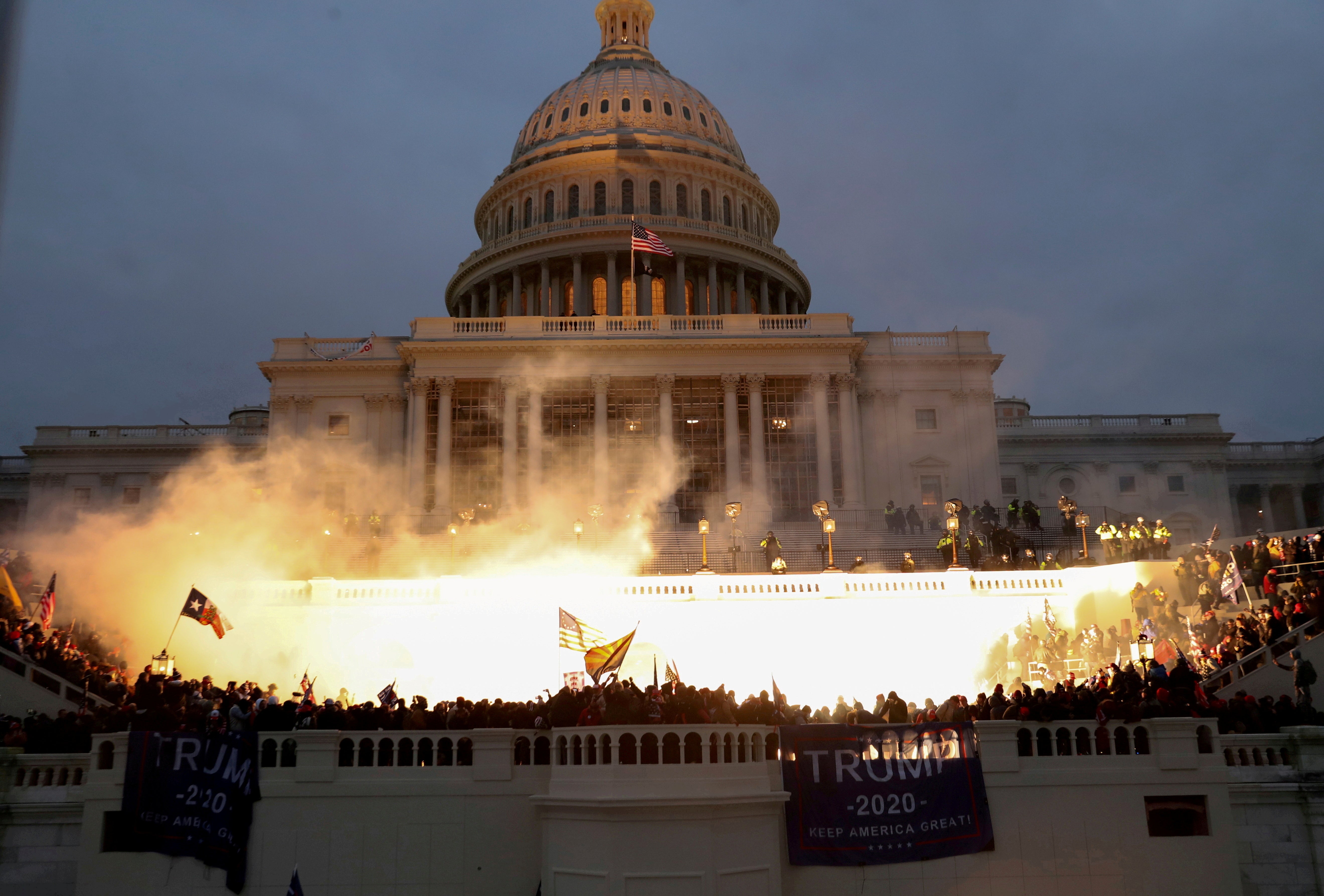 An explosion caused by a police munition as Trump supporters stormed the Capitol on 6 January 2021