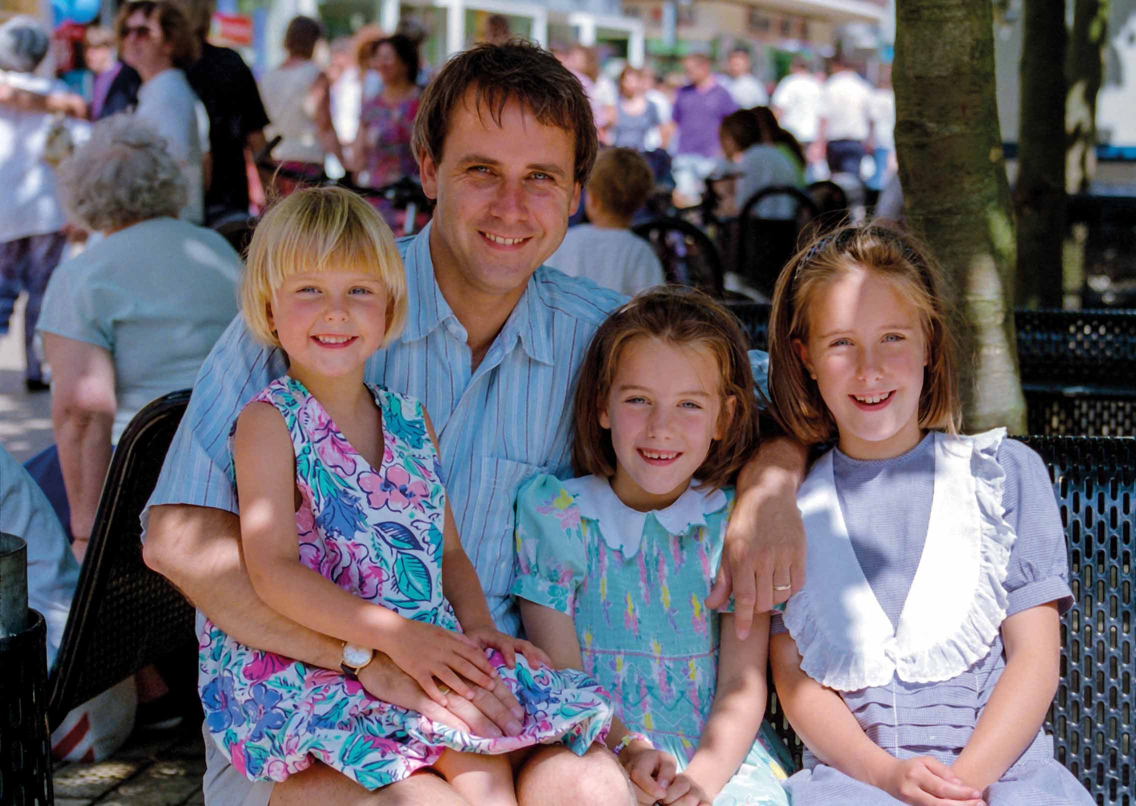 Dr Richard Scott with his three daughters in Bridge Street, Peterborough in 1994