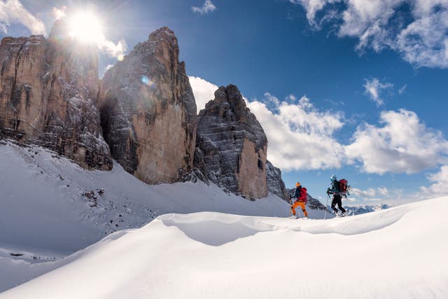 <p>Skiers touring Italy’s Dolomites</p>