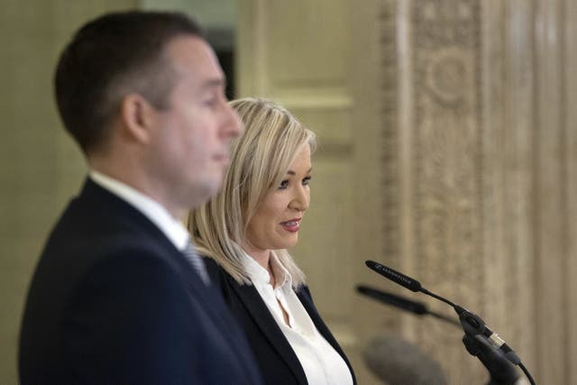 First Minister Paul Givan (left) and Deputy First Minister Michelle O’Neill in the Great Hall of Parliament Buildings at Stormont, announcing new Covid restrictions for Northern Ireland (PA)