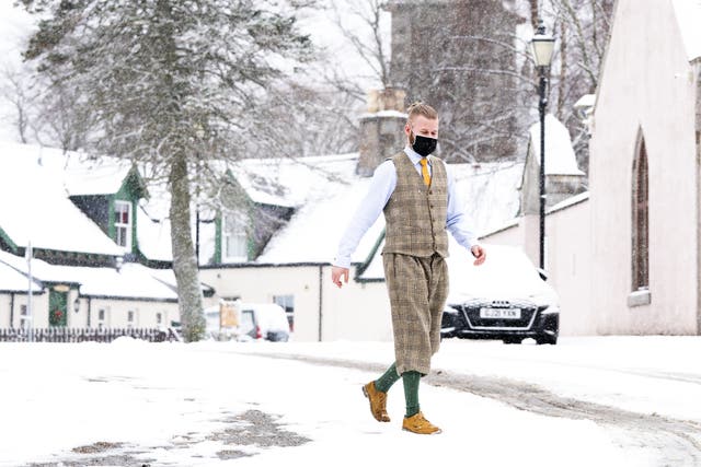 A man walks through the snow in Braemar, Aberdeenshire (Jane Barlow/PA)