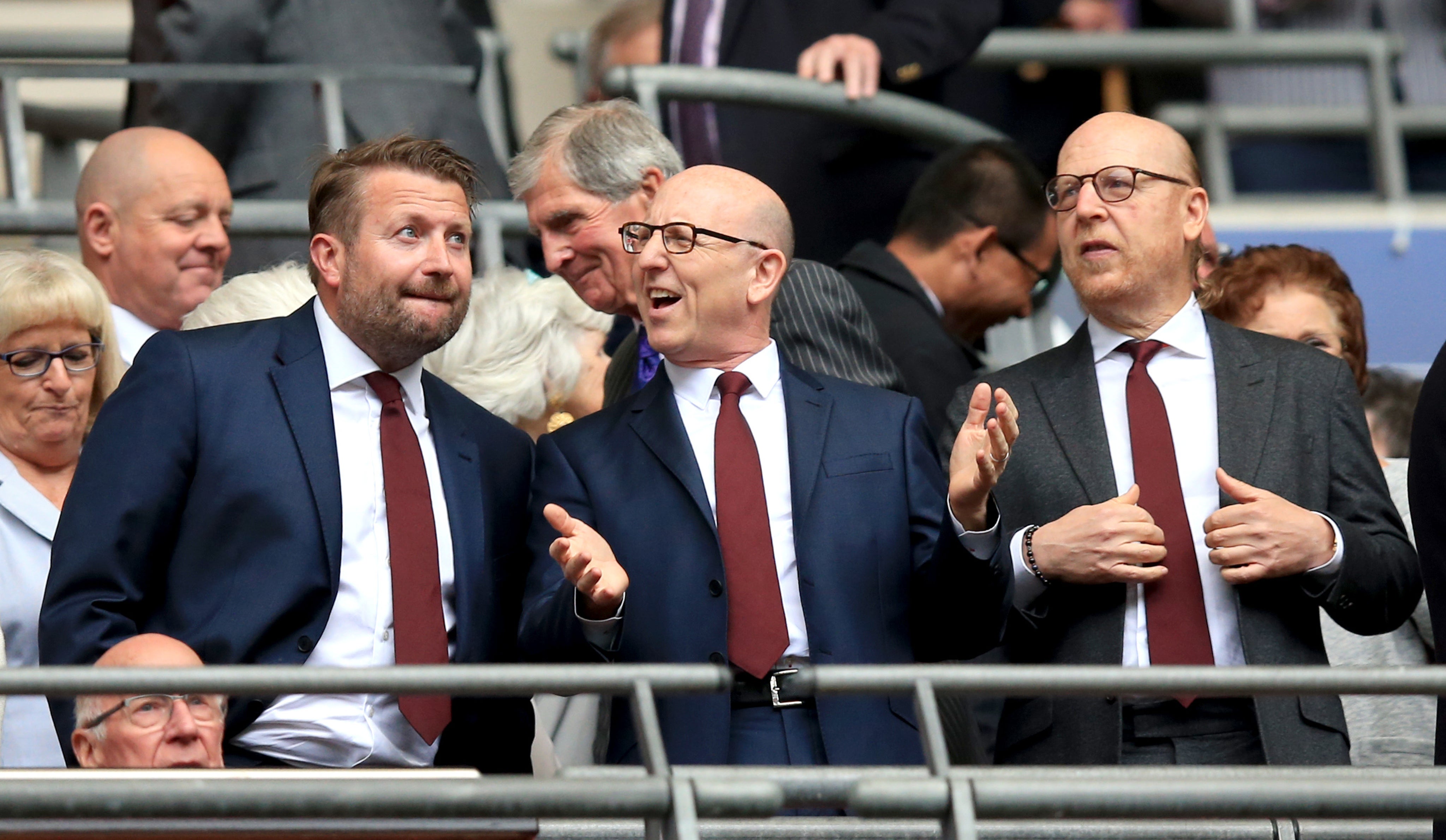 Richard Arnold (left) with United co-chairmen Joel Glazer and Avram Glazer (Mike Egerton/PA)