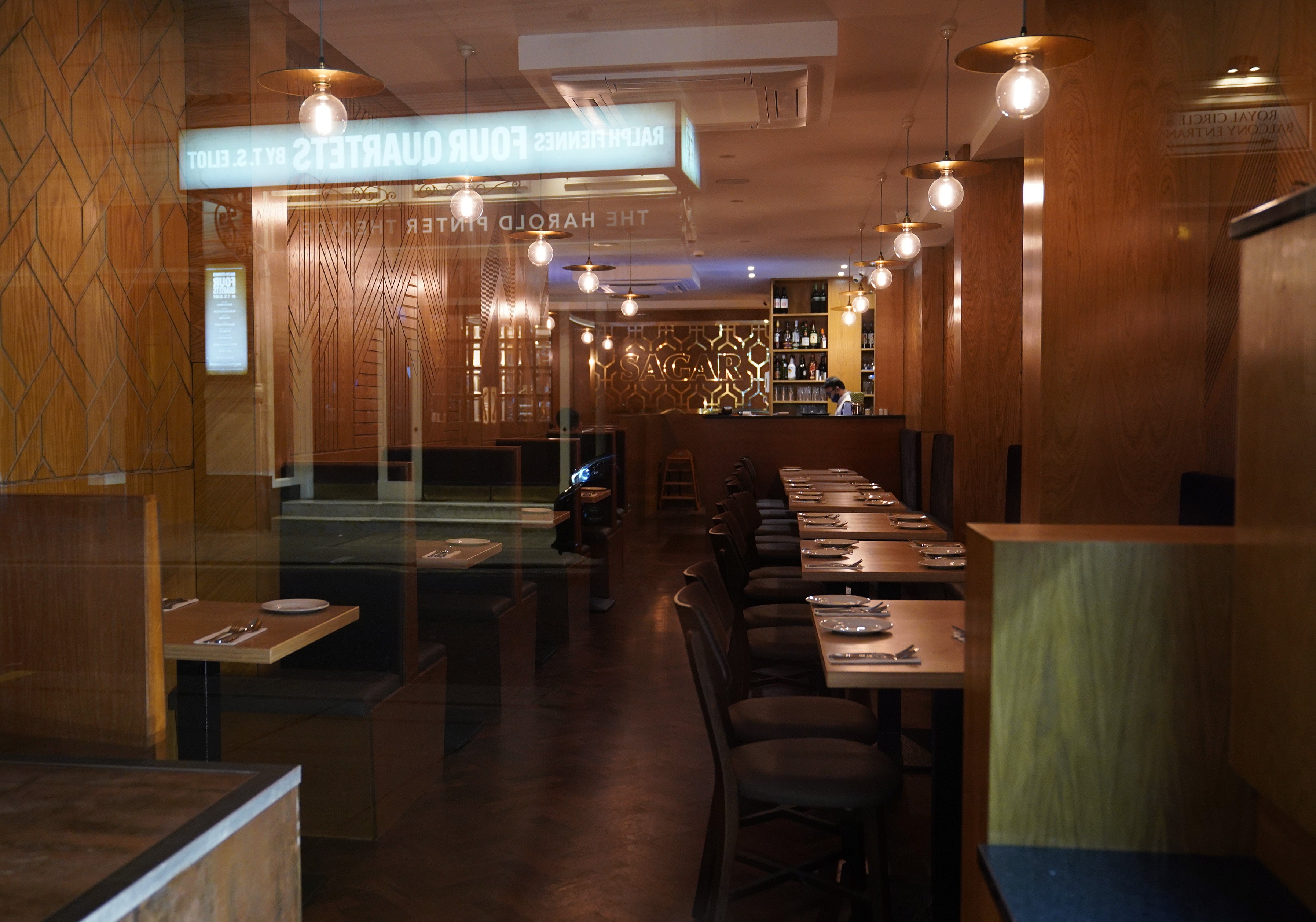 Empty tables in a restaurant in central London (Yui Mok/PA)