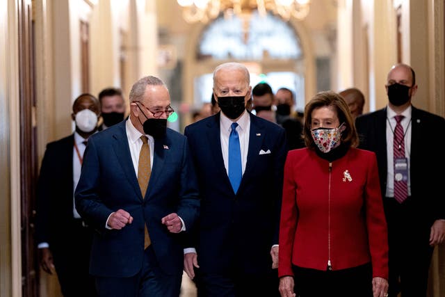 <p>Senate Majority Leader Chuck Schumer (left) and House Speaker Nancy Pelosi with President Joe Biden in January </p>