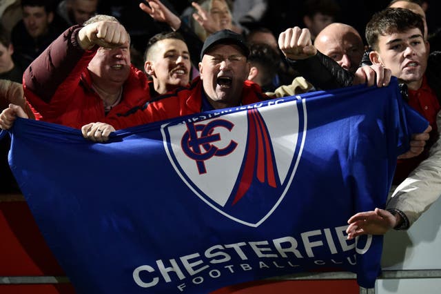 <p>Chesterfield fans celebrate during their FA Cup second round victory</p>