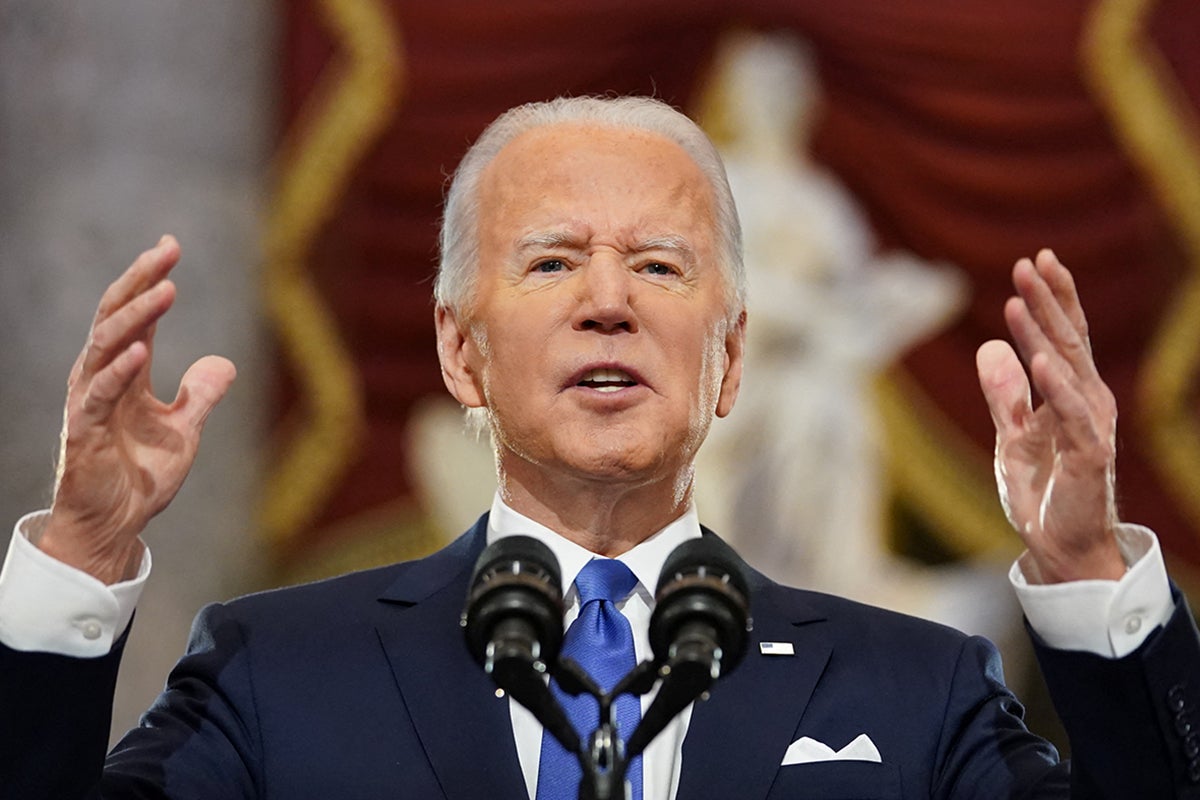 US President Joe Biden speaks in Statuary Hall on the first anniversary of the 6 January 2021 attack on the US Capitol by supporters of former President Donald Trump, on Capitol Hill in Washington.