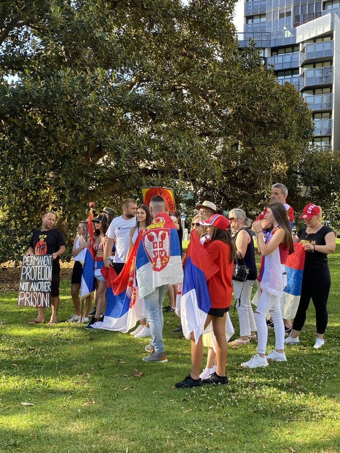 Supporters of Novak Djokovic gathered outside The Park Hotel in Melbourne (@najsambul/PA)