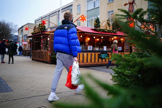 Total UK footfall for 2021 was 33.2% down on pre-pandemic levels (Ben Birchall/PA)