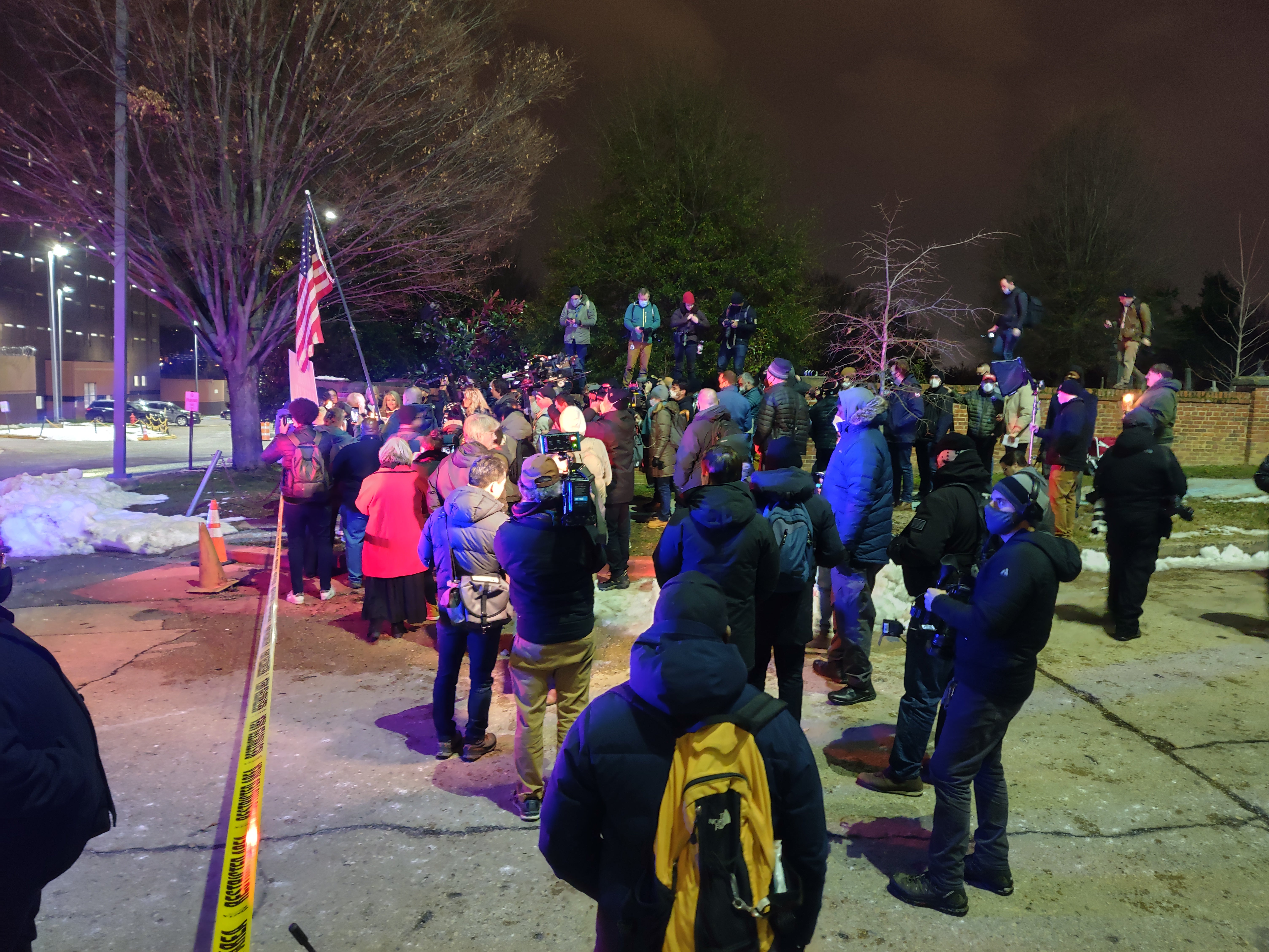 Media overwhelm Capitol riot supporters at a candlelight vigil outside the DC jail