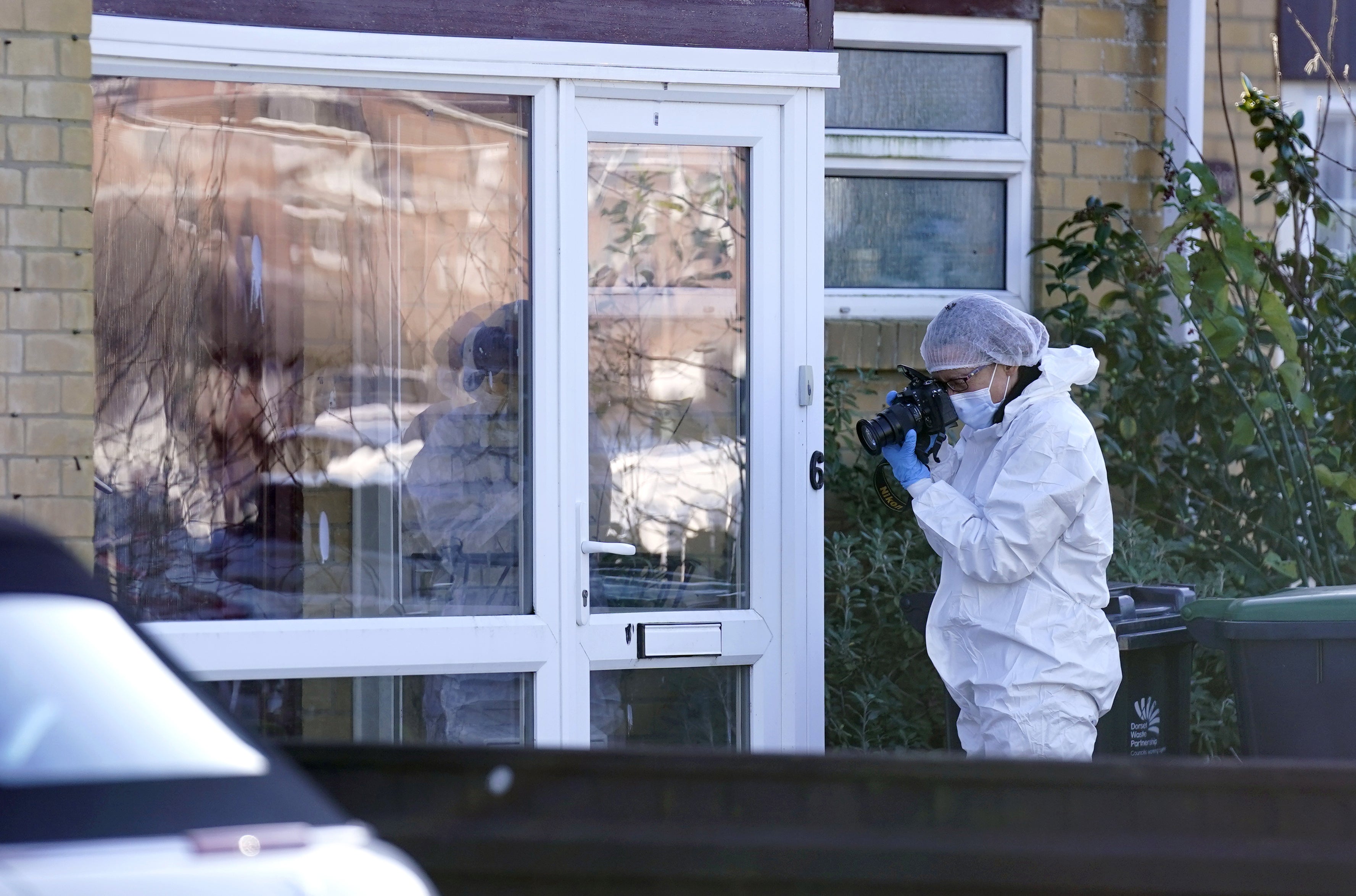 Forensics at the scene in Heath Road, Christchurch, Dorset, where police have launched a murder investigation following the discovery of the body of a man in his 30s on Tuesday evening. (Andrew Matthews/PA)