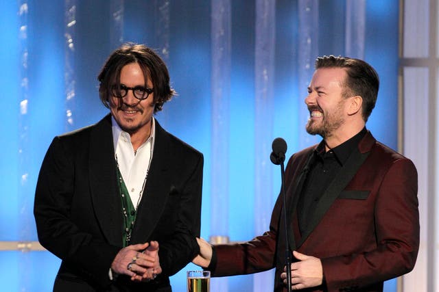 <p>‘The Tourist’ nominee Johnny Depp and recurring Golden Globes host Ricky Gervais at the 2012 Globes</p>