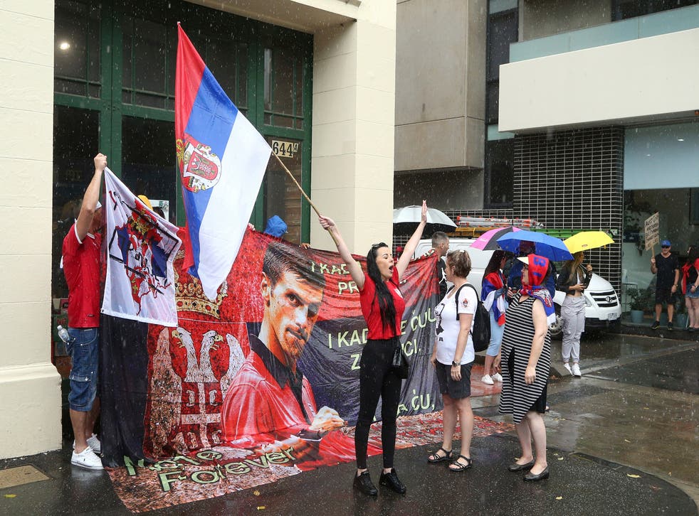 <p>Protestors gather outside an immigration detention hotel where Serbia’s Novak Djokovic is believed to be staying in Melbourne</p>