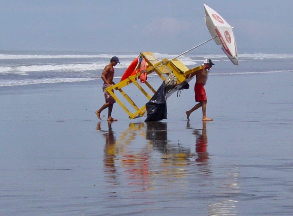 <p>Homeward bound: lifeguards on Costa Rica’s Pacific coast, from where 292 passengers are currently isolating after their plane landed 13 minutes too early at Gatwick   </p>