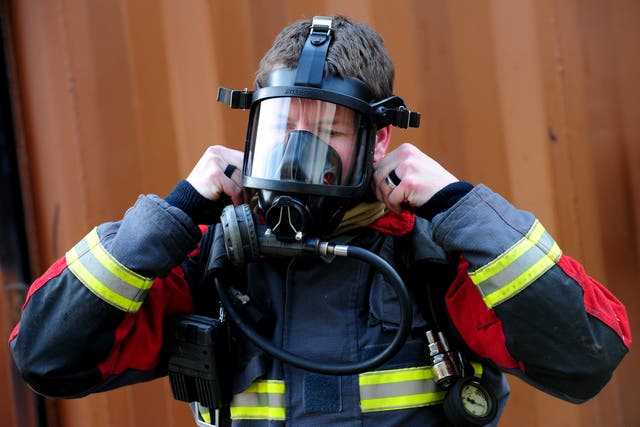 Firefighters during an advanced breathing apparatus and fire behaviour training session (Rui Vieira/PA)