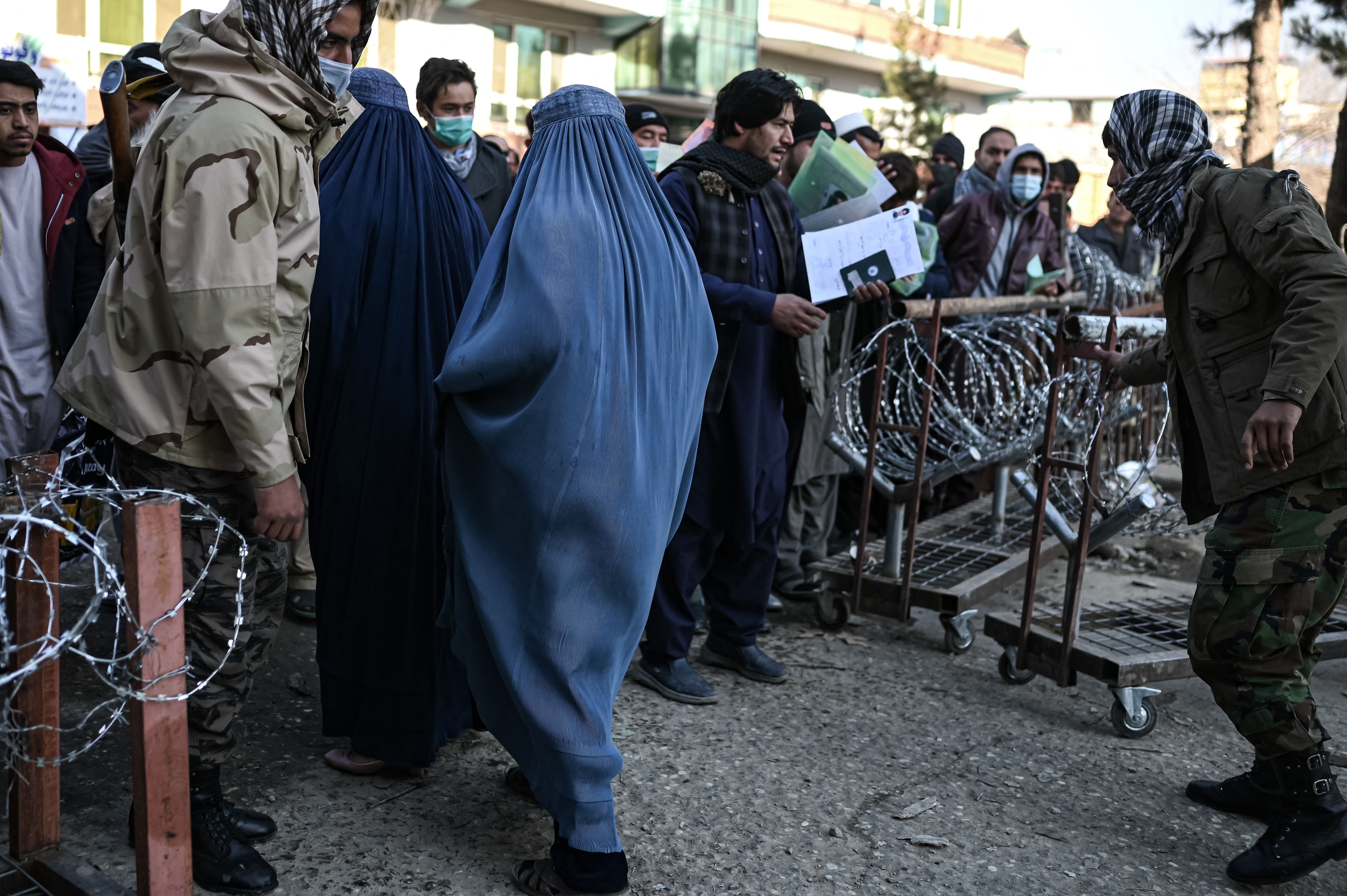 A woman wearing a burqa leaves the passport office in Kabul last month