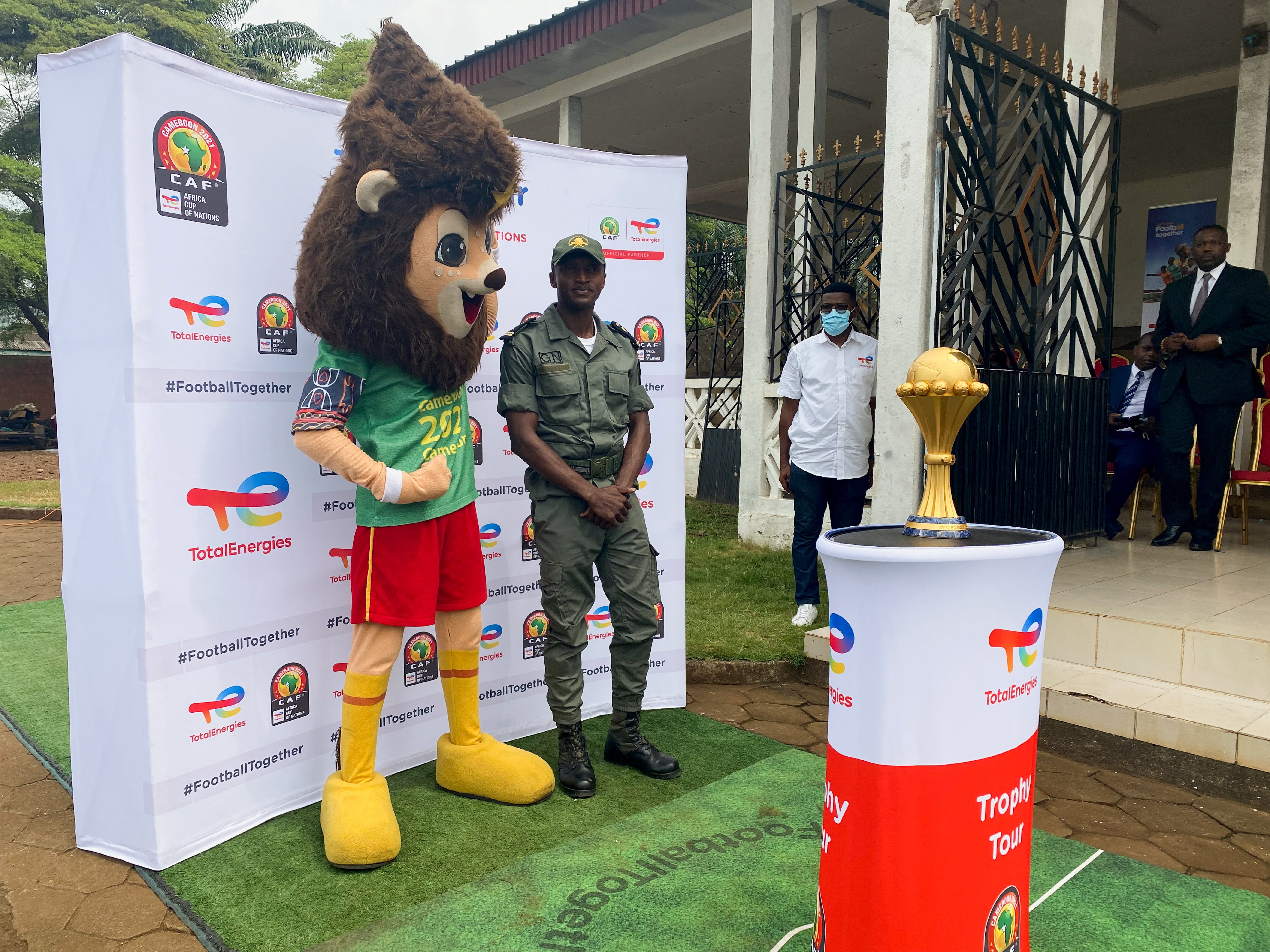 A soldier with the Africa Cup of Nations mascot in Limbe, Cameroon