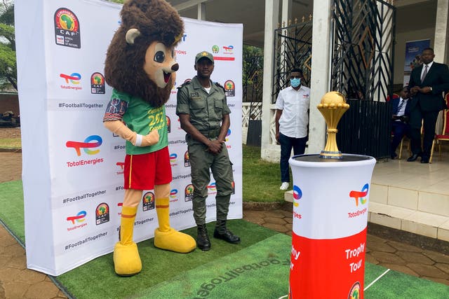 <p> A soldier with the Africa Cup of Nations mascot in Limbe, Cameroon</p>
