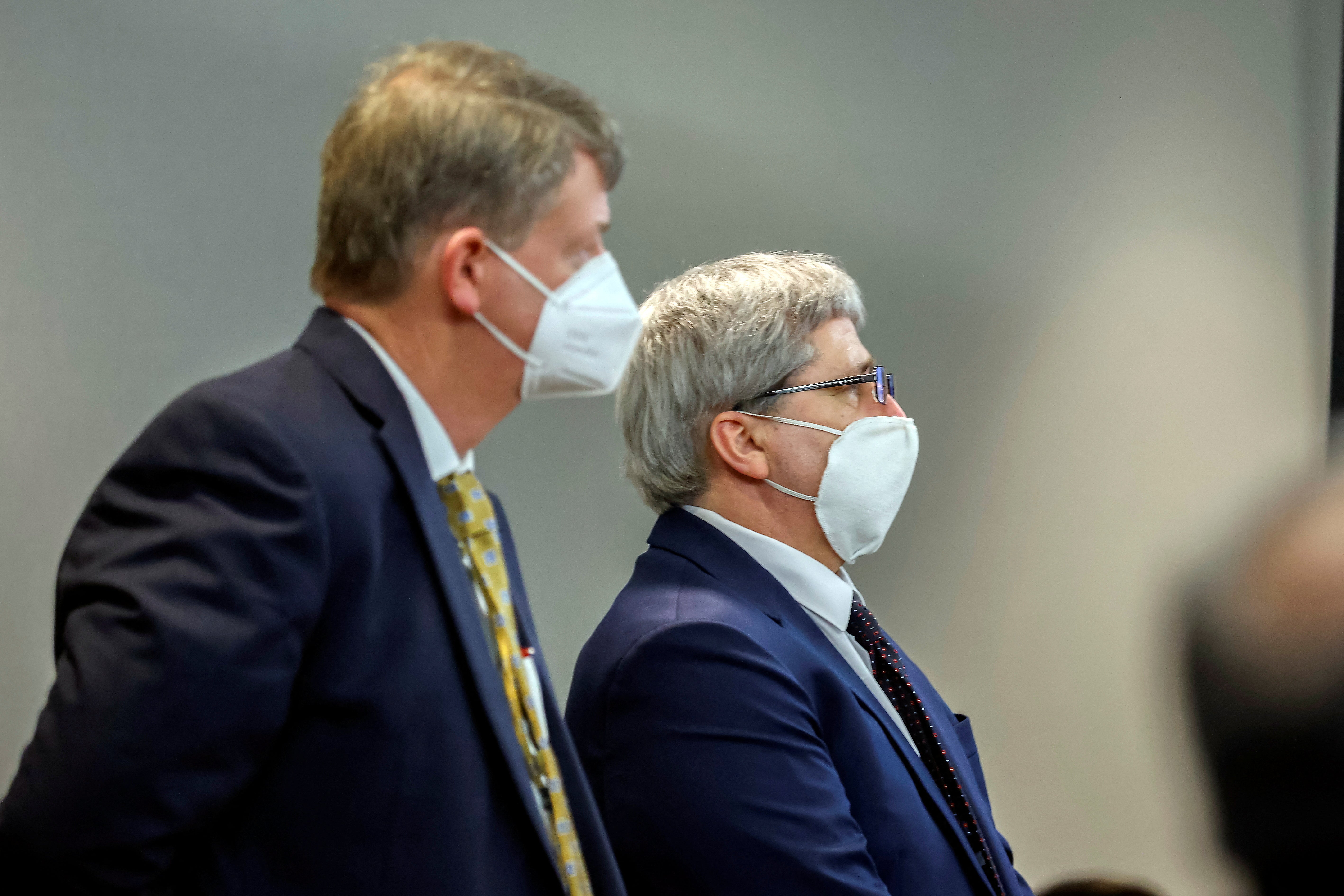 William "Roddie" Bryan, centre, stands with his attorney Kevin Gough, left, while superior court Judge Timothy Walmsley reads his sentence