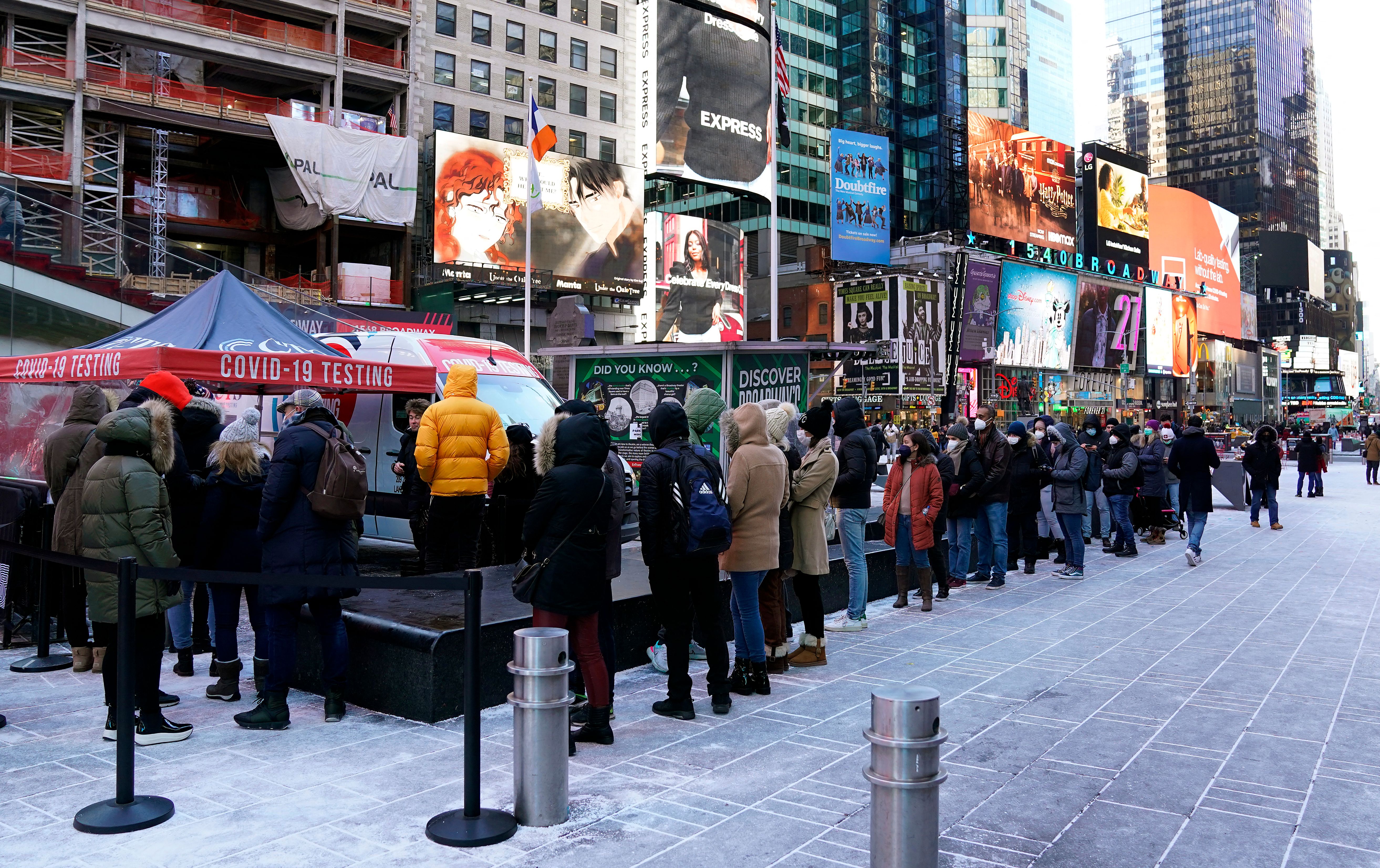 People line up for Covid-19 testing in Times Square on 4 January 2022, in New York City.