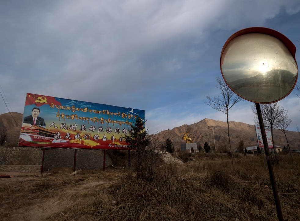 <p>Poster showing China’s President Xi Jinping is seen next to a freeway outside of Tongren, Qinghai province on March 2, 2018</p>